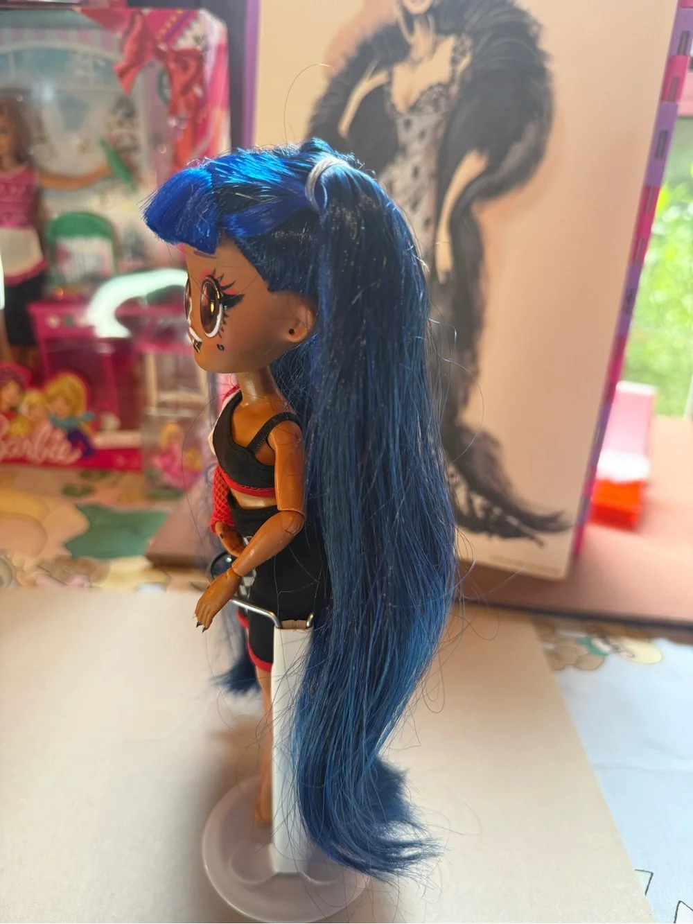 L.O.L. Doll with Vibrant Blue Hair and Black-Red Outfit